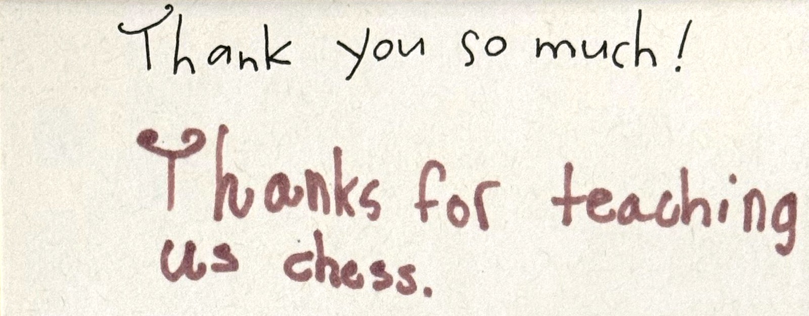 A handwritten note from children in black and plum marker: Thank you so much! Thanks for teaching us chess.